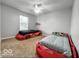 Fun bedroom with two race car beds and a ceiling fan at 4689 Muscatine Way, Westfield, IN 46062