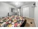 Comfortable bedroom with a floral comforter, dresser, and closet at 4689 Muscatine Way, Westfield, IN 46062