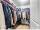 A walk-in closet with ample storage space and well-organized clothing racks at 4689 Muscatine Way, Westfield, IN 46062