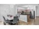 Open dining area connected to the kitchen, featuring a marble table and modern decor at 4689 Muscatine Way, Westfield, IN 46062