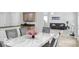 Open-concept dining room with marble table and grey chairs, granite countertops, and open access to other living areas at 4689 Muscatine Way, Westfield, IN 46062
