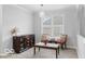 Cozy dining room showcasing a stylish buffet, seating, window, and modern lighting fixture at 4689 Muscatine Way, Westfield, IN 46062