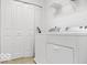 Laundry room with a modern washer and dryer, and extra shelf storage at 4689 Muscatine Way, Westfield, IN 46062