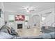 Comfortable living room featuring a fireplace, large TV, plenty of windows, and an open floor plan at 4689 Muscatine Way, Westfield, IN 46062