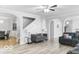 Open-concept living room with modern decor, connecting to the dining area and featuring large sofas and stylish accents at 4689 Muscatine Way, Westfield, IN 46062