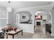 Inviting living room with an archway, comfortable seating, and view of the adjacent living space at 4689 Muscatine Way, Westfield, IN 46062