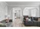 Spacious living area with archways, comfortable seating, and a cohesive, modern design at 4689 Muscatine Way, Westfield, IN 46062