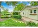 Charming backyard with a hammock, stone pathway, and well-maintained lawn, perfect for relaxation at 5148 Crittenden Ave, Indianapolis, IN 46205