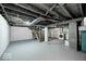 Unfinished basement with exposed ceiling, washer, dryer, and painted foundation at 5148 Crittenden Ave, Indianapolis, IN 46205