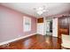 Bedroom boasts hardwood floors, ensuite access, and a decorative barn door at 5148 Crittenden Ave, Indianapolis, IN 46205