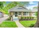 Charming home featuring stone accents, a well-manicured lawn, and inviting curb appeal at 5148 Crittenden Ave, Indianapolis, IN 46205