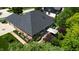 An aerial shot of the rear of the home featuring an outdoor dining area and beautifully landscaped yard at 5350 Chico Grey Dr, Indianapolis, IN 46237