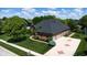 Beautiful aerial view of a brick home, with an attached garage and well-maintained yard, on a sunny day at 5350 Chico Grey Dr, Indianapolis, IN 46237