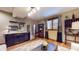 Basement view with kitchenette area, including refrigerator and wine rack for entertaining at 5350 Chico Grey Dr, Indianapolis, IN 46237