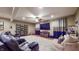 Finished basement with theater seating, a large TV, custom draperies, and decorative accents at 5350 Chico Grey Dr, Indianapolis, IN 46237
