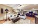 Recreation area in basement with bar, TV, couches and table with football decor at 5350 Chico Grey Dr, Indianapolis, IN 46237