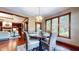 Inviting dining area featuring wood floors and natural light, adjacent to the cozy living space at 5350 Chico Grey Dr, Indianapolis, IN 46237