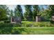 Community entrance gate framed by lush greenery, providing a welcoming and private entry to the neighborhood at 5350 Chico Grey Dr, Indianapolis, IN 46237