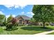 Charming single-Gathering home with a well-manicured lawn, mature trees, and tidy landscaping at 5350 Chico Grey Dr, Indianapolis, IN 46237