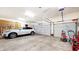 Spacious garage with ample storage and parking for a vehicle and equipment at 5350 Chico Grey Dr, Indianapolis, IN 46237