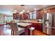 Well-appointed kitchen with stainless steel refrigerator, granite countertops, and modern fixtures at 5350 Chico Grey Dr, Indianapolis, IN 46237