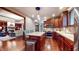Gourmet kitchen featuring rich wood cabinets, stainless steel appliances, and an island with seating at 5350 Chico Grey Dr, Indianapolis, IN 46237