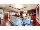 Open-concept living room featuring hardwood floors, ample seating, and great natural light at 5350 Chico Grey Dr, Indianapolis, IN 46237
