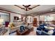 Spacious living room with hardwood floors, and comfortable seating, featuring a fireplace at 5350 Chico Grey Dr, Indianapolis, IN 46237