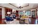 Inviting living room with hardwood floors, custom built-ins, and a cozy seating arrangement at 5350 Chico Grey Dr, Indianapolis, IN 46237