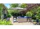 Enjoy the patio area featuring comfortable seating, an umbrella, and plenty of space to relax outdoors at 5350 Chico Grey Dr, Indianapolis, IN 46237