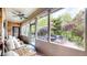 Inviting screened porch for relaxing with outdoor seating and views of the yard at 5350 Chico Grey Dr, Indianapolis, IN 46237