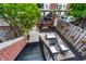 Private backyard featuring a patio with outdoor furniture and lush greenery at 536 Lockerbie S Cir, Indianapolis, IN 46202
