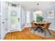 Cozy dining area with a round table, stylish chairs, and door with windows at 536 Lockerbie S Cir, Indianapolis, IN 46202