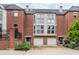 Charming brick townhome with attached garages and manicured landscaping at 536 Lockerbie S Cir, Indianapolis, IN 46202