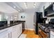 Modern kitchen features stainless steel appliances, granite countertops, and white cabinetry at 536 Lockerbie S Cir, Indianapolis, IN 46202