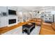 Comfortable living room with a fireplace, leather sofas, and stylish built-in bookshelves at 536 Lockerbie S Cir, Indianapolis, IN 46202
