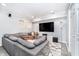 A cozy, finished basement living room features recessed lighting and a large sectional sofa at 536 Lockerbie S Cir, Indianapolis, IN 46202