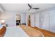 Comfortable main bedroom with hardwood floors, access to the Primary bathroom, and closet space at 536 Lockerbie S Cir, Indianapolis, IN 46202