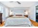 Spacious main bedroom featuring hardwood floors, neutral colors, and stylish lighting at 536 Lockerbie S Cir, Indianapolis, IN 46202