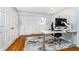 Bright office space with a skylight, built-in storage, and a modern adjustable standing desk at 536 Lockerbie S Cir, Indianapolis, IN 46202