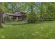 The lush green backyard is an ideal outdoor retreat with a deck perfect for entertaining at 577 Century Oaks Dr, Zionsville, IN 46077