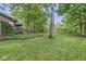 Spacious backyard with a deck and lush landscaping, perfect for outdoor enjoyment at 577 Century Oaks Dr, Zionsville, IN 46077