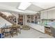 Finished basement area with a table, chairs, and built-in shelves at 577 Century Oaks Dr, Zionsville, IN 46077
