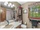 Bathroom with neutral walls, decorative towels, and a window above the toilet at 577 Century Oaks Dr, Zionsville, IN 46077