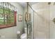 Bathroom featuring a glass shower enclosure, window, and neutral wall color at 577 Century Oaks Dr, Zionsville, IN 46077