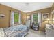 Cozy bedroom with light walls, two windows, and white dressers at 577 Century Oaks Dr, Zionsville, IN 46077