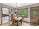 Cozy breakfast nook with natural light and views of the wooded backyard at 577 Century Oaks Dr, Zionsville, IN 46077
