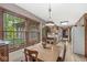 Quaint breakfast nook adjacent to kitchen with large windows and natural wood floors at 577 Century Oaks Dr, Zionsville, IN 46077