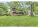 Traditional two-story home with brick accents, a well-maintained lawn, and mature trees at 577 Century Oaks Dr, Zionsville, IN 46077