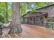 Backyard home view showcases a wooded deck, screened porch and inviting outdoor living spaces at 577 Century Oaks Dr, Zionsville, IN 46077